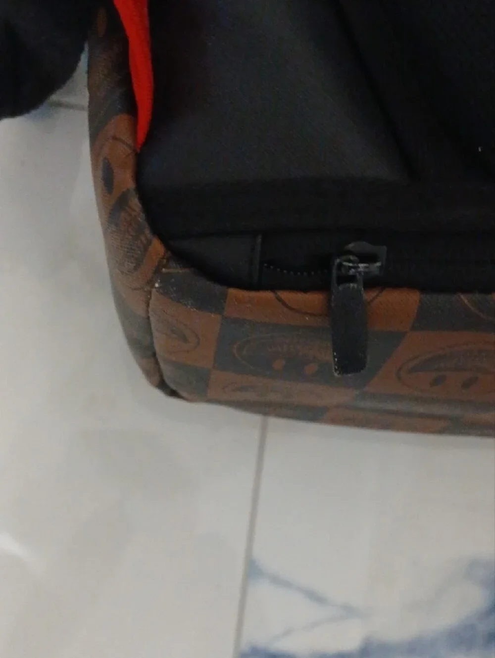 Sprayground Brown Checkerboard Backpack with Multicolor Sticker Graphics